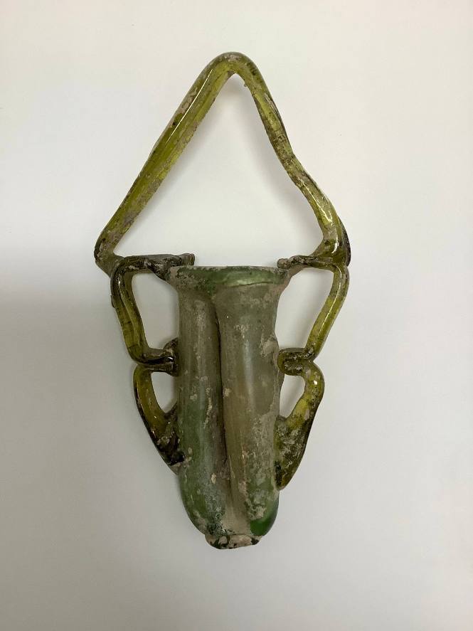 Roman double cosmetic tube with high handle of trailed loops