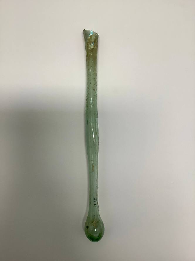 Unguentarium with bulb-shaped bottom and flaring body; lip missing