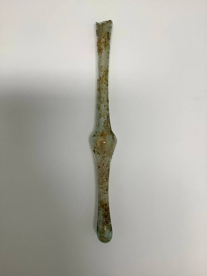 Roman unguentarium with flaring body; bulge in middle