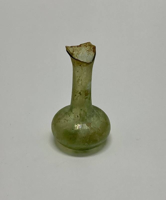 Flask or unguentarium with slightly concave base, flaring rim broken