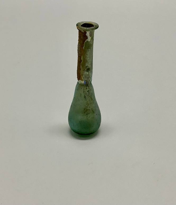 Roman unguentarium with constriction between body and neck; folded rim