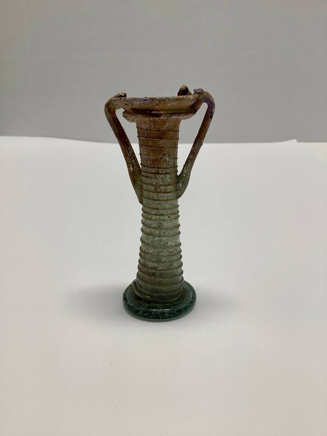 Roman Balsamarium with two handles and horizontal ribbing on neck; trailed spiral thread decoration around body