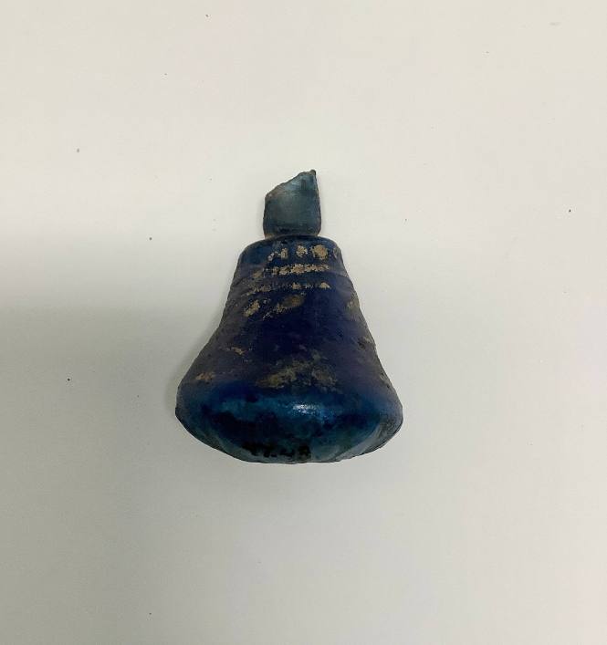 Mold-pressed (?) vessel with teardrop pattern at base