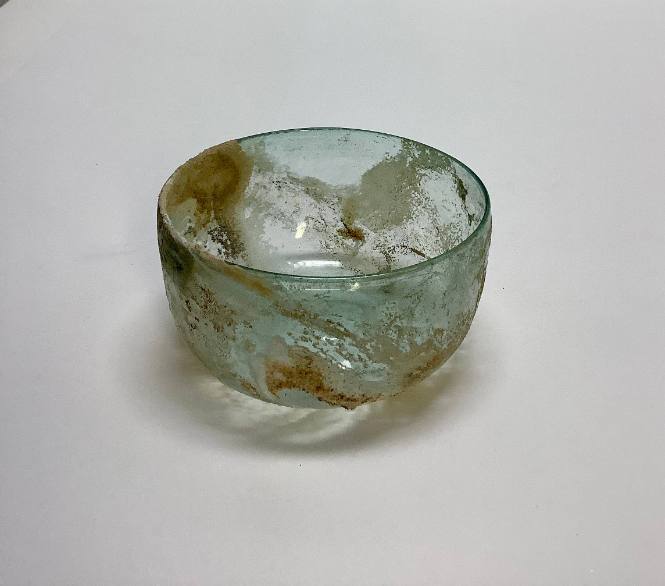 Deep bowl with concave base and straight sides