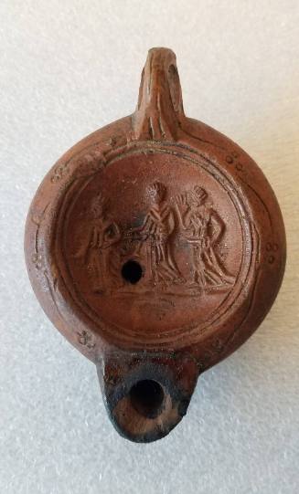 Lamp with relief of three females