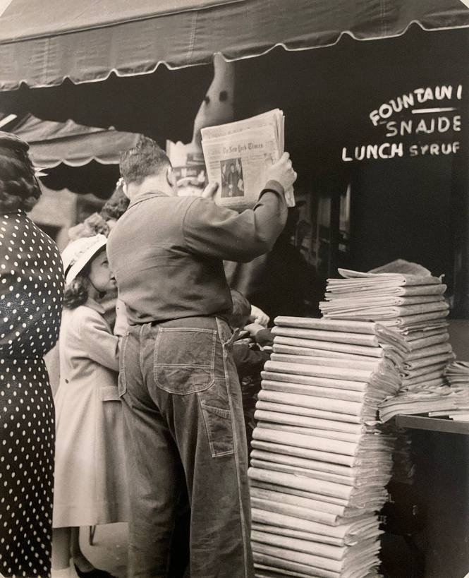 New York Times - Man with Newspaper and Stack