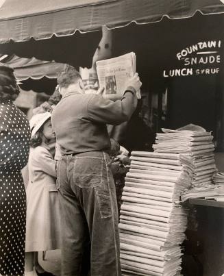 New York Times - Man with Newspaper and Stack