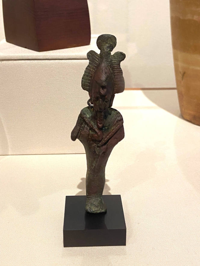 Statuette of Osiris, God of the Dead, with shepherd's crook and flail, wearing atef crown with sun disc