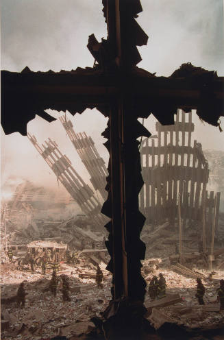 [Cross above firemen and wreckage]