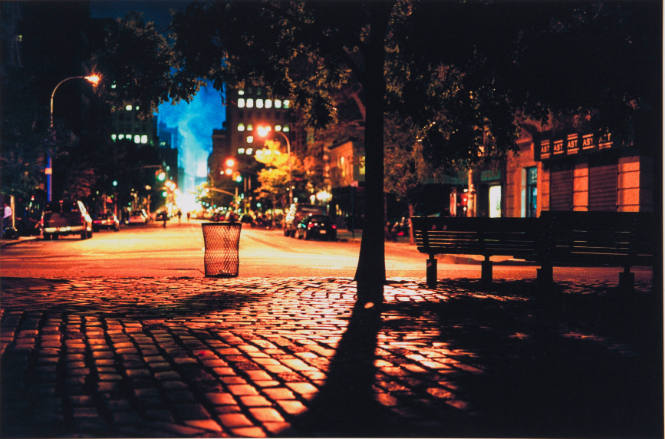 [Night view downtown, distant smoke]