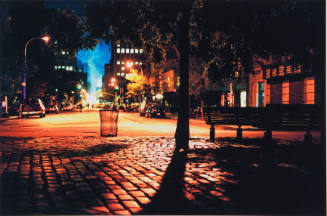 [Night view downtown, distant smoke]