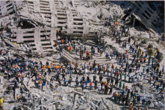 [Rescue workers in wreckage, from above]