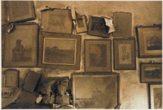 [Ash-laden pictures on a wall]