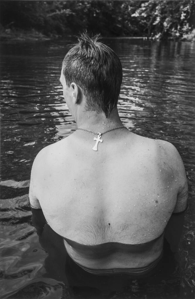The watering hole. Man with Cross. 