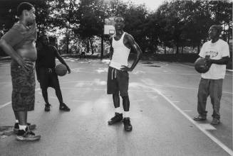 Ice playing basketball with children. Market Street. Poughkeepsie, NY.