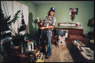 Untitled (Man in cluttered living room, from Millerton PPortfolio)