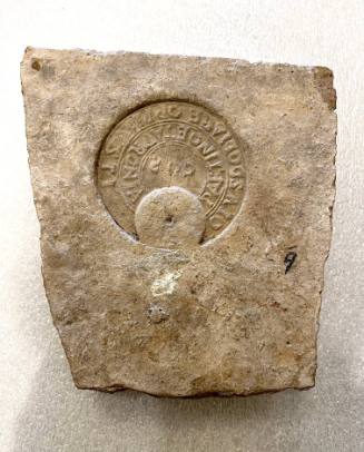 Fragment with latin inscription on crescent-shaped ground